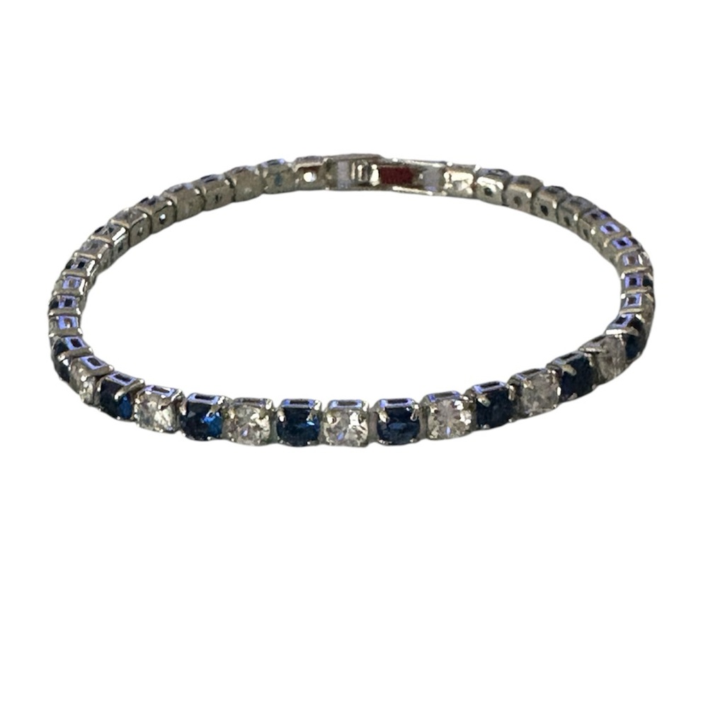 925 silver tennis bracelet with blue/white synthetic cubic zirconia stones. 7.5”